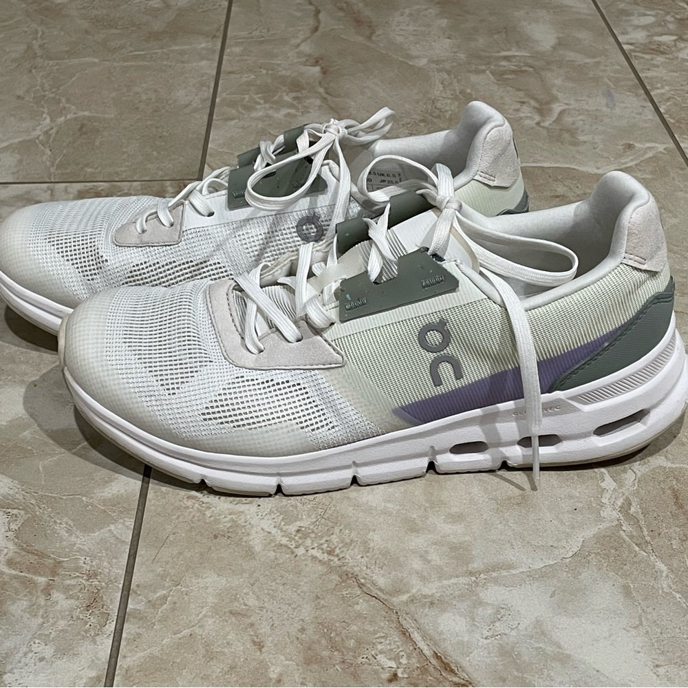 On Running White and Green Athletic Shoes